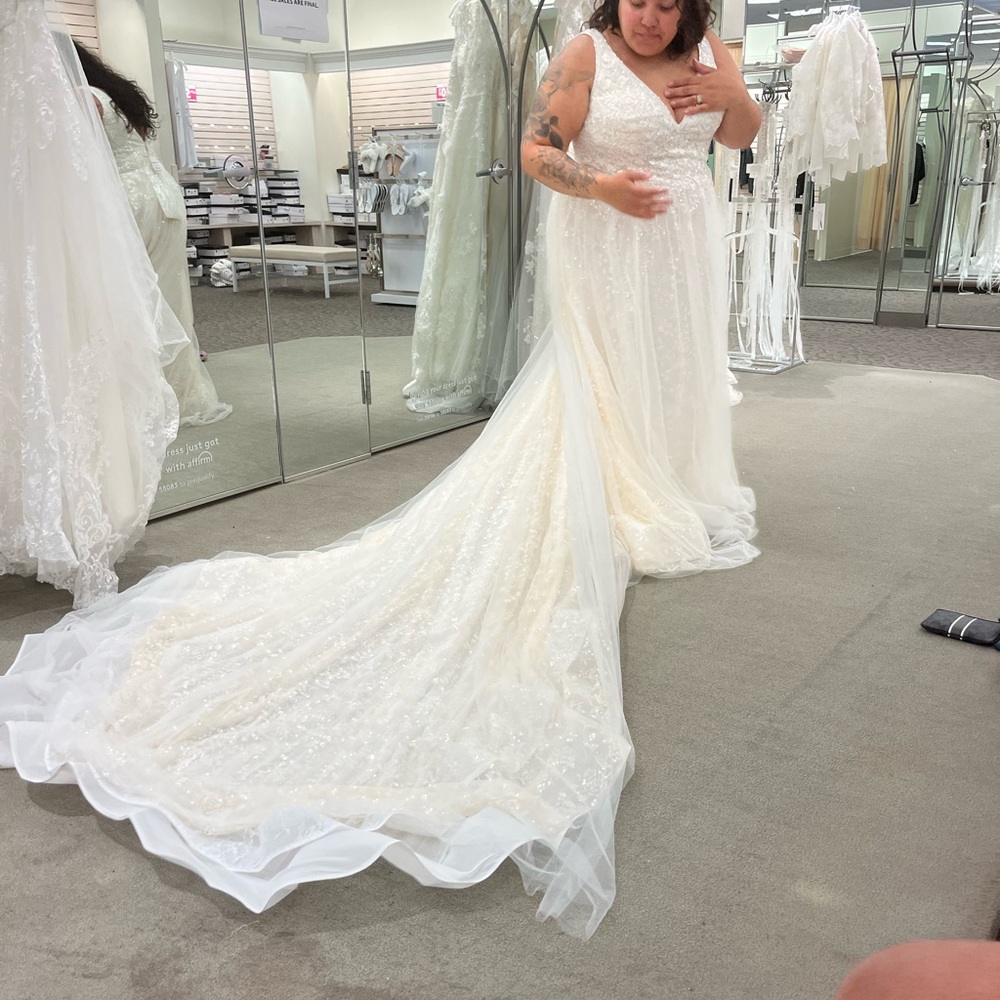 Brand new wedding dress. Size 18. Never worn with tags. Galina Signature